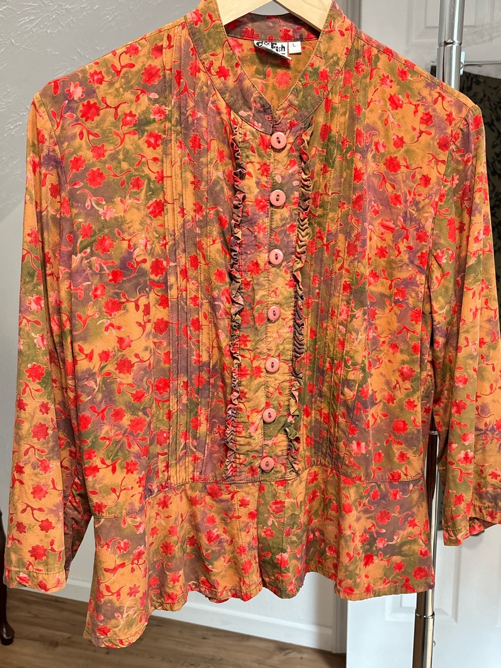 Romantic pleated button down with ruffles and peplum waist. Go Fish size large